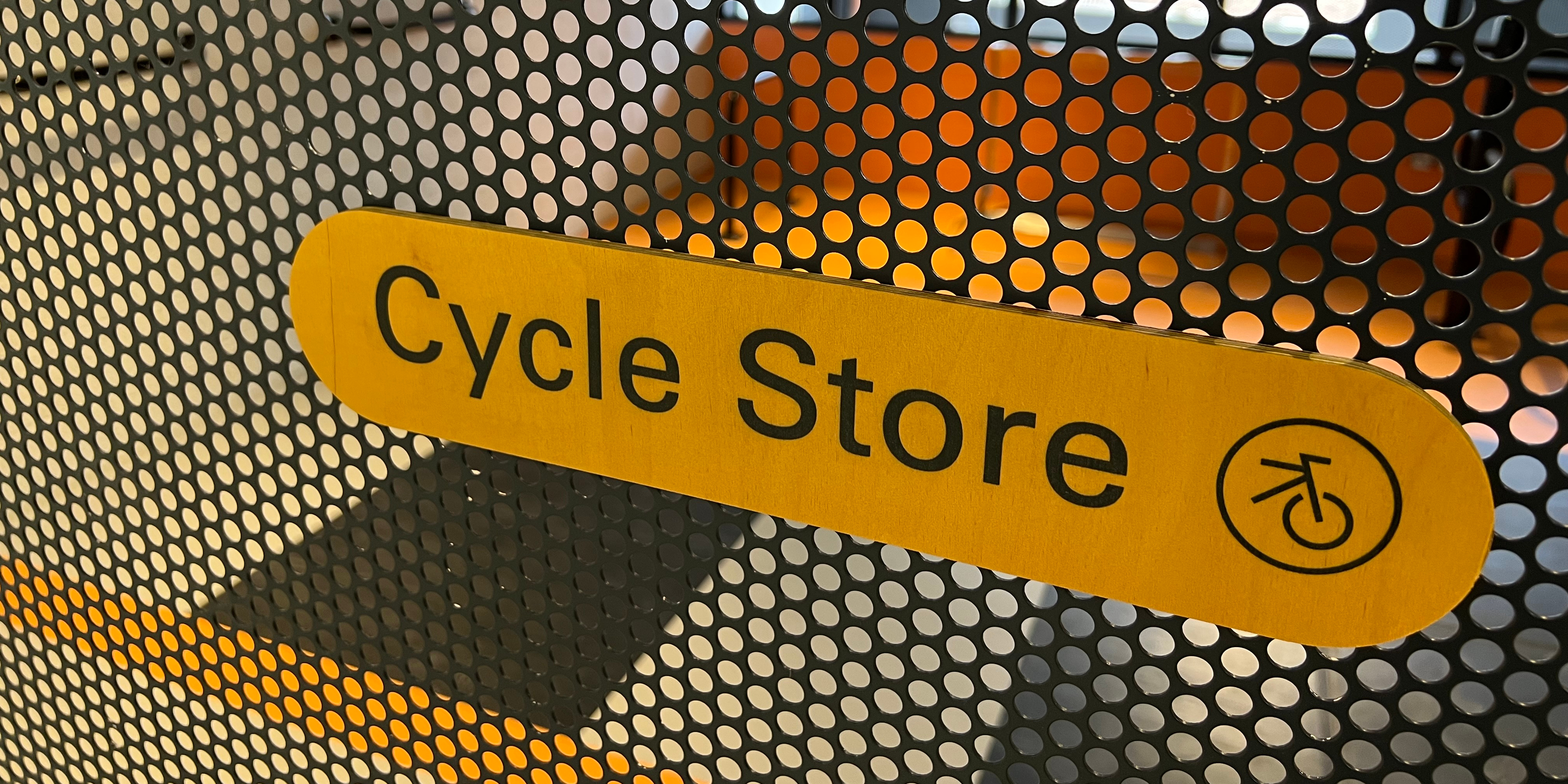 A Bike Dock Solutions and Shelter Store Staff Member waiting to load an item